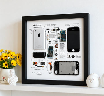 iPhone 1st Generation teardown frame displayed on a white shelf as modern tech wall art