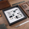 iPhone 1st gen teardown frame on desk, minimalist tech wall decor for office or studio